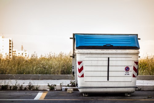 Front view of a commercial waste collection vehicle in Wimbledon area